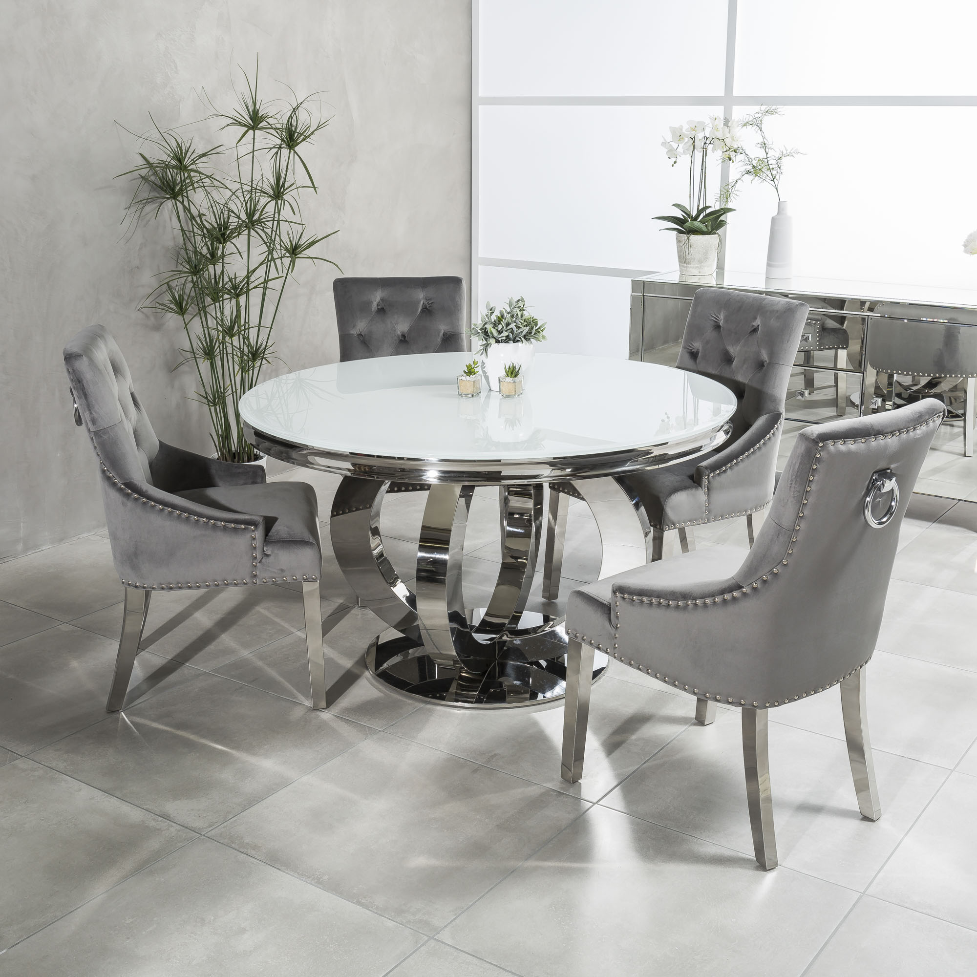 13m Circular Polished Steel White Glass Dining Table Set With 4 Grey Brushed Velvet Dining Chairs Grosvenor Furniture