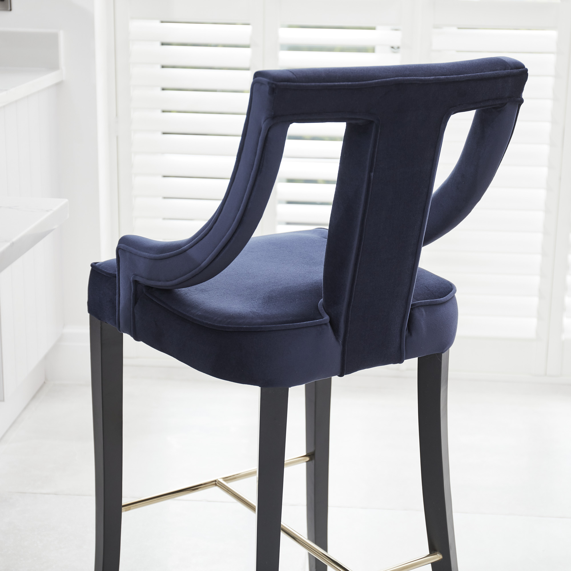 Juliette Dark Blue Velvet Bar Stool with Gold Trim Footrest