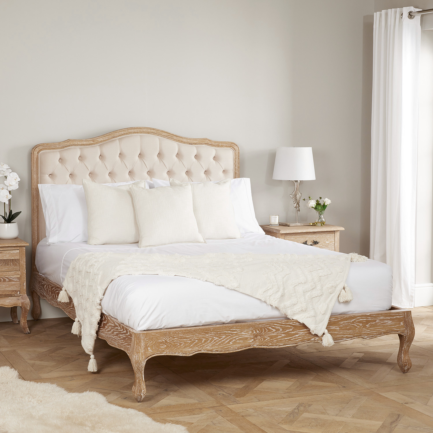 Eléa French Weathered Limed Oak Upholstered Button Back Low Foot Board Bed – King Size